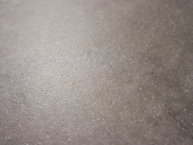 Close-up van een grijze vloer met een subtiele, matte afwerking en een zachte textuur, die een moderne uitstraling biedt.